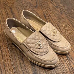CHANEL Tan Quilted Loafers with Gold Logo turnlock